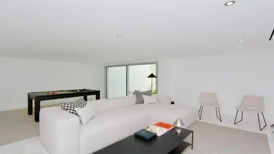 a white living room with a white couch and a table at Villa BEA - Clever Details, Luxury, Golf views, Sleeps 10 in Vilamoura