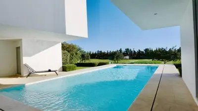 a swimming pool in a house at Villa BEA - Clever Details, Luxury, Golf views, Sleeps 10 in Vilamoura