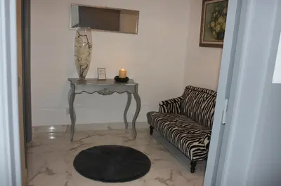 a living room with a couch and a table with a candle at Yucca in Faro