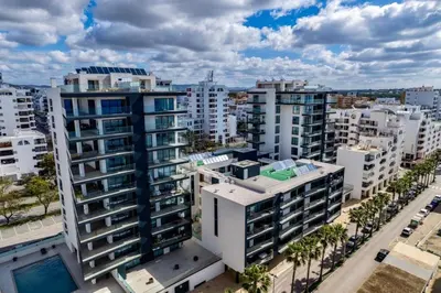 an aerial view of a city with tall buildings at Terraços de Quarteira Green by Real Properties in Quarteira