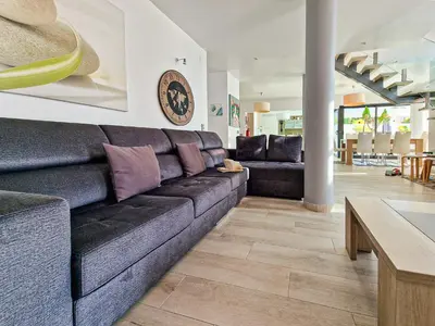 a living room with a couch and a table at Villa Stefy by Bedzy in Galé