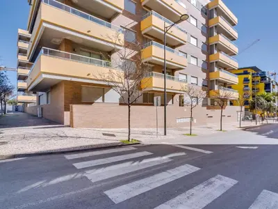 an empty street in front of a building at AL - Apartamento Carteia in Quarteira