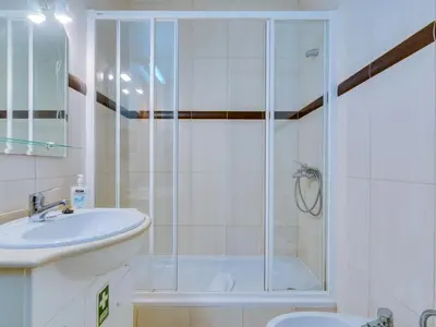 a bathroom with a shower and a sink at AL - Apartamento Pinhal da Praia in Vilamoura