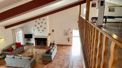 a living room with two couches and a fireplace at Espraguina by Check-in Portugal in Loulé