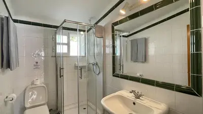 a bathroom with a sink and a shower and a toilet at Espraguina by Check-in Portugal in Loulé