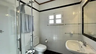 a white bathroom with a toilet and a sink at Espraguina by Check-in Portugal in Loulé