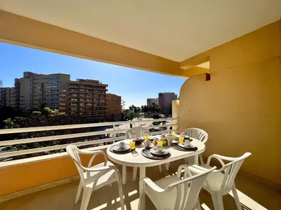 a white table and chairs on a balcony with a view at Vilamoura Marina Mar 2 With Pool by Homing in Vilamoura