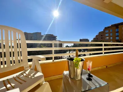 a white chair and a table on a balcony with a view at Vilamoura Marina Mar 2 With Pool by Homing in Vilamoura