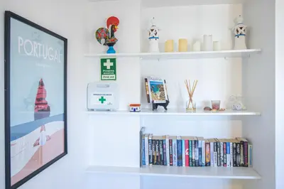 a room with white shelves with books at Old Town 2BR 50m Ocean w/ AC Wi-Fi Parking Terrace in Albufeira