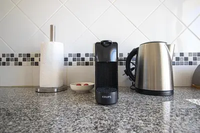 a coffee maker on a counter in a kitchen at Old Town 2BR 50m Ocean w/ AC Wi-Fi Parking Terrace in Albufeira