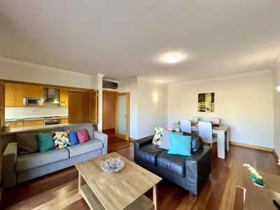 a living room with a couch and a table at Albufeira Modern 4 With Pool by Homing in Albufeira