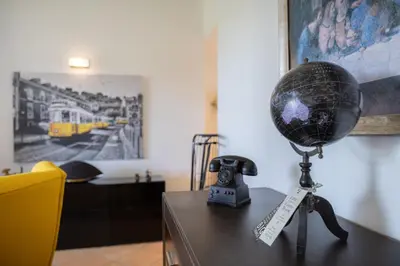 a desk with a ball on top of a table with a telephone at VILASOL - 