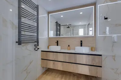 a bathroom with two sinks and a mirror at VILASOL - 