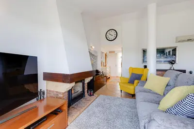 a living room with a couch and a fireplace at VILASOL - 