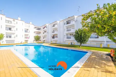 a living room with a couch and a table at #112 Oura Flat by Home Holidays in Albufeira