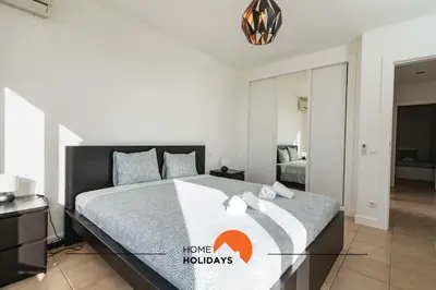 a bedroom with a large bed in a room at #111 Ocean View by Home Holidays in Albufeira