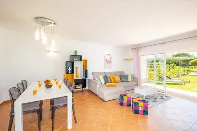 a living room with a couch and a table at Beachsun Gale - beautiful villa close to beach in Galé