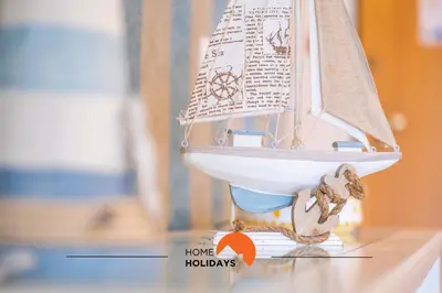 a model boat on a table with a toy boat on it at #115 Bernardo Flat by Home Holidays in Albufeira