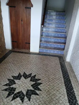 a tile floor with a staircase with a star on it at AZULEJOS em VILAMOURA PORTUGAL in Vilamoura