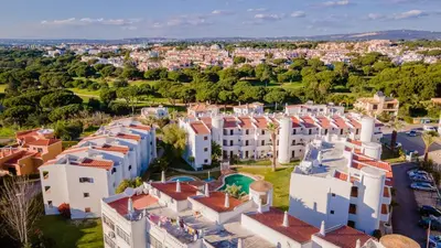 an aerial view of a city with white buildings at Terraços do Mar Apartment W/ Pool by LovelyStay in Vilamoura