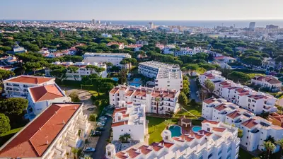 an aerial view of a city with white buildings at Terraços do Mar Apartment W/ Pool by LovelyStay in Vilamoura