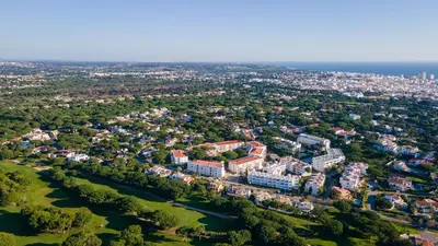 an aerial view of a city with buildings and trees at Terraços do Mar Apartment W/ Pool by LovelyStay in Vilamoura