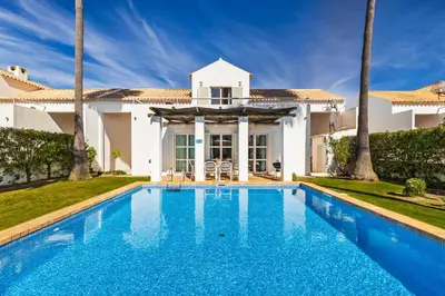 a swimming pool in front of a villa at Villa Luz do Atlantico by OCvillas in Galé