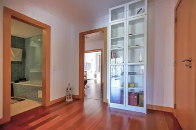 a hallway with a door open to a room at Luxury Apartment with Pool in Albufeira