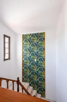 a staircase with a colorful mural on the wall at Patroves Ranch - private pool & sea views in Albufeira