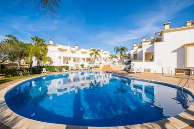 a large swimming pool in front of a villa at Villa Arade - Complex ideal for families in Albufeira