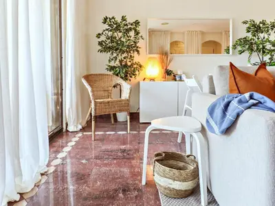 a living room with a couch and a table at Falésia's Harmony -5min to the beach by LovelyStay in Albufeira