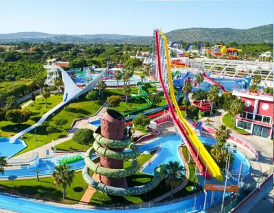 an amusement park with a roller coaster at Quarteira Beach Vacation: 2BR steps to the sand in Quarteira