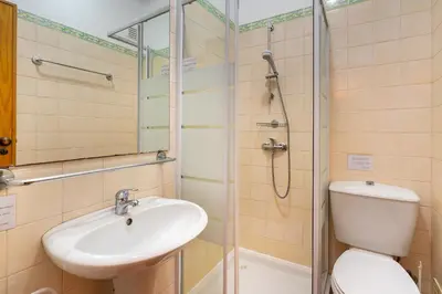 a bathroom with a toilet and a sink and a shower at Family Apartment Pool & Terrace in Vilamoura