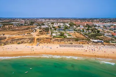 an aerial view of a beach with a group of people at Villa Farol by OCvillas in Galé