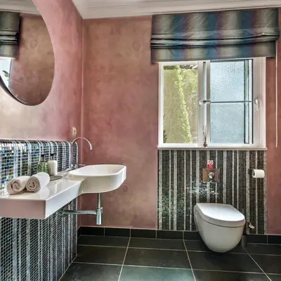 a bathroom with a toilet and a sink and a window at Villa Millennium luxury villa relaxing location in Almancil