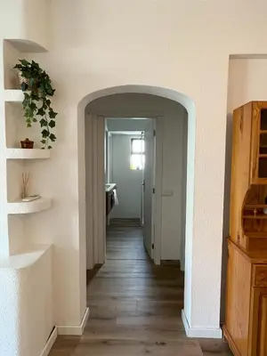 a hallway with an archway leading into a room at Apartamento Diago in Albufeira