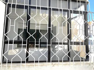 a wrought iron gate on the side of a building at Apartamento Diago in Albufeira