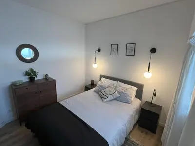 a bedroom with a bed with two pillows on it at Apartamento Diago in Albufeira