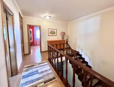 a staircase in a house with a stair case at Vila Caravela - Private Pool by HD Properties in Vilamoura