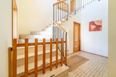 a staircase in a home with white walls at Villa Gale Grande - bright airy property with a private pool in Albufeira
