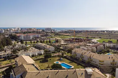 an aerial view of a city with a pool at Apartamento King in Vilamoura