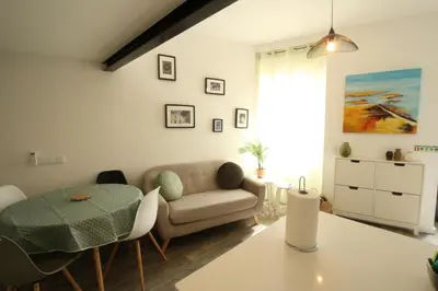 a living room with a couch and a table at Downtown Villa in Faro
