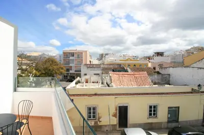 a balcony with a view of a city at Downtown Villa in Faro