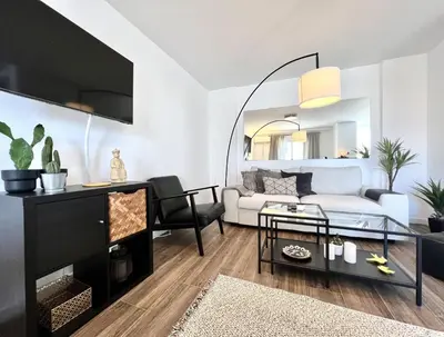 a living room with a couch and a table at Vista by the Nest - City Center HD PROPERTIES in Faro