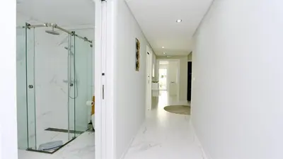 a bathroom with a glass shower and a mirror at Marina Retreat - CleverDetails, for 2 adults and 2 children, Jacuzzi, near the Marina and the beach in Vilamoura