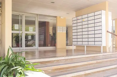 an empty lobby of a building with glass doors at CORTEZ - Vilamoura in Vilamoura