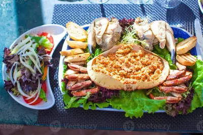 a plate of food with a sandwich and a salad at Albufeira Forest View With Pool by Homing in Albufeira