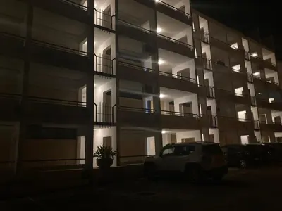 a car parked in front of a building at night at Vilamoura Apartamento Algarve 311 in Vilamoura