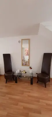 two chairs in a room with a table and a mirror at Star Dreams Albufeira in Albufeira