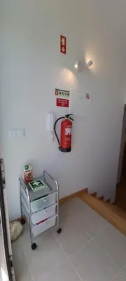 a room with a fire extinguisher on the wall at Star Dreams Albufeira in Albufeira